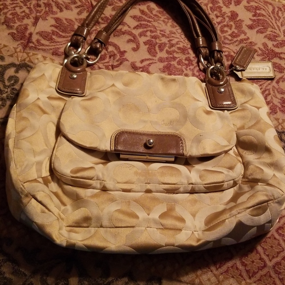 Tan logo coach purse